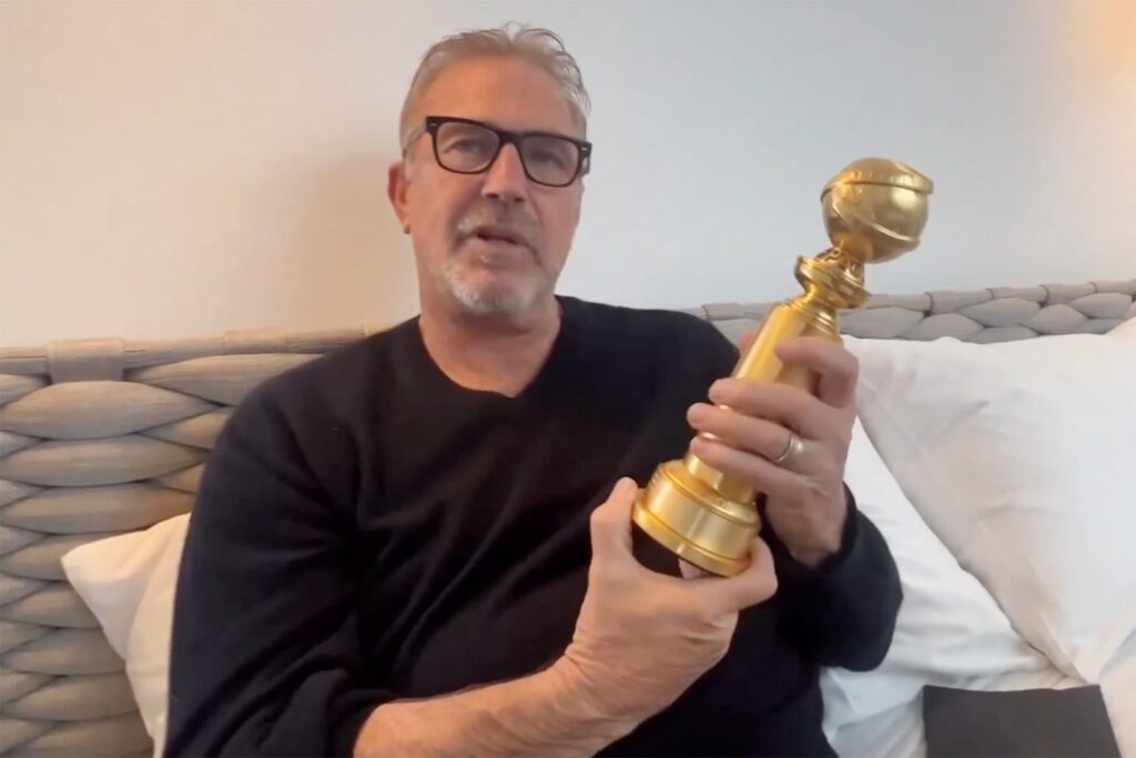 kevin costner holding Golden Globe-Best Performance by an Actor award